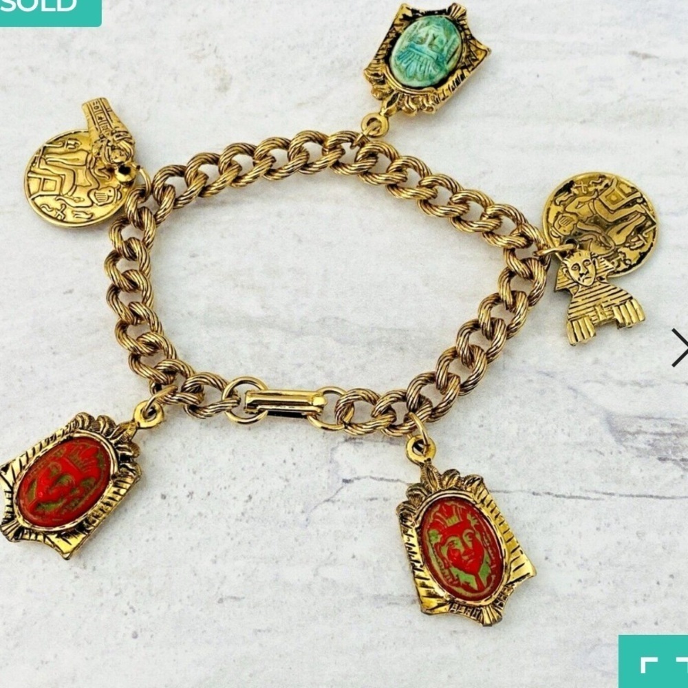 Vintage Egyptian revival Czech glass pharoah
Face charm bracelet Bracelet